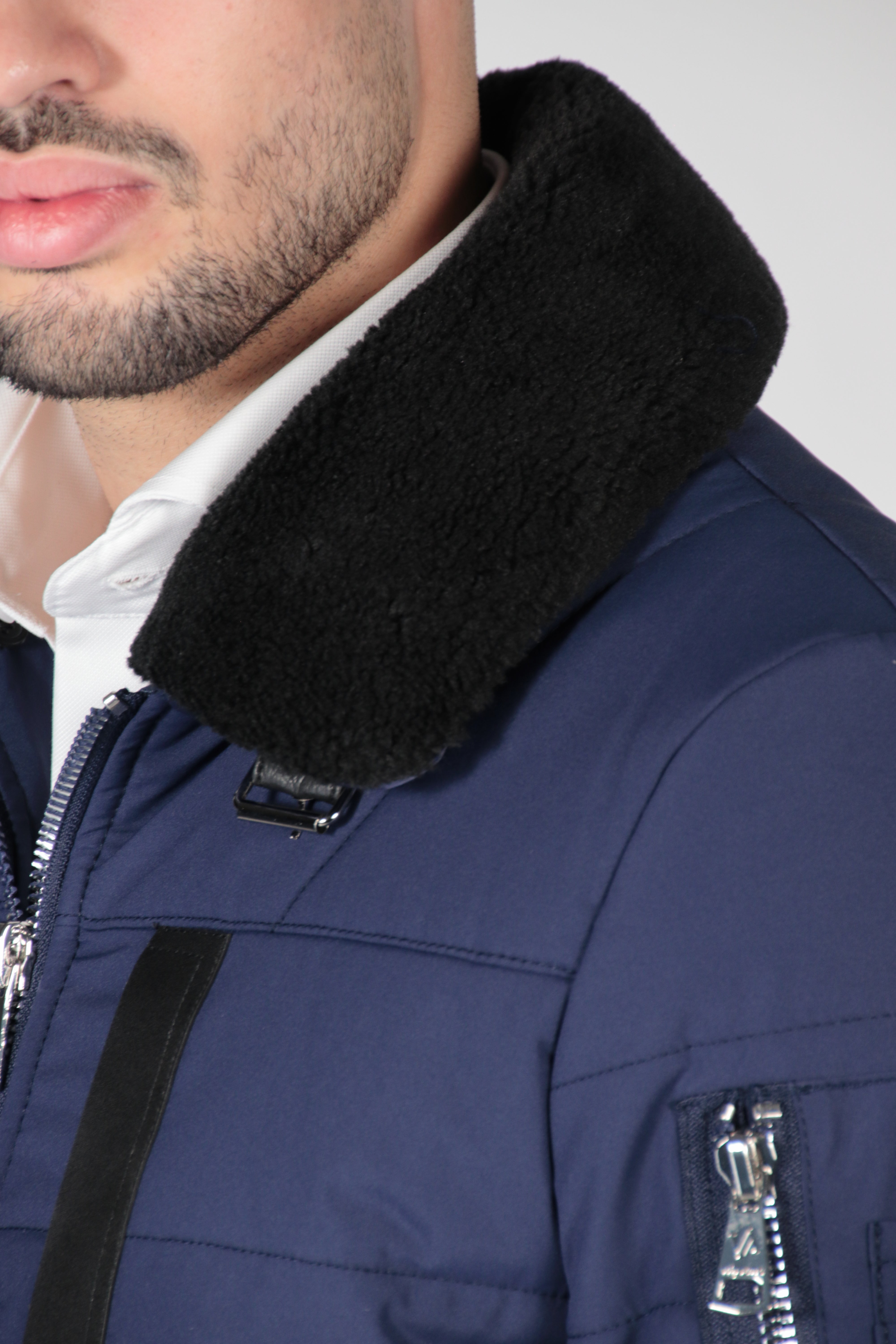 Blue bomber jacket with black collar